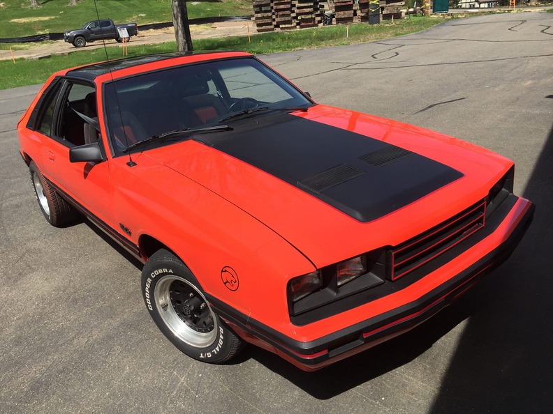 Red Mercury Capri front three-quarter view after a full GTCustomz respray