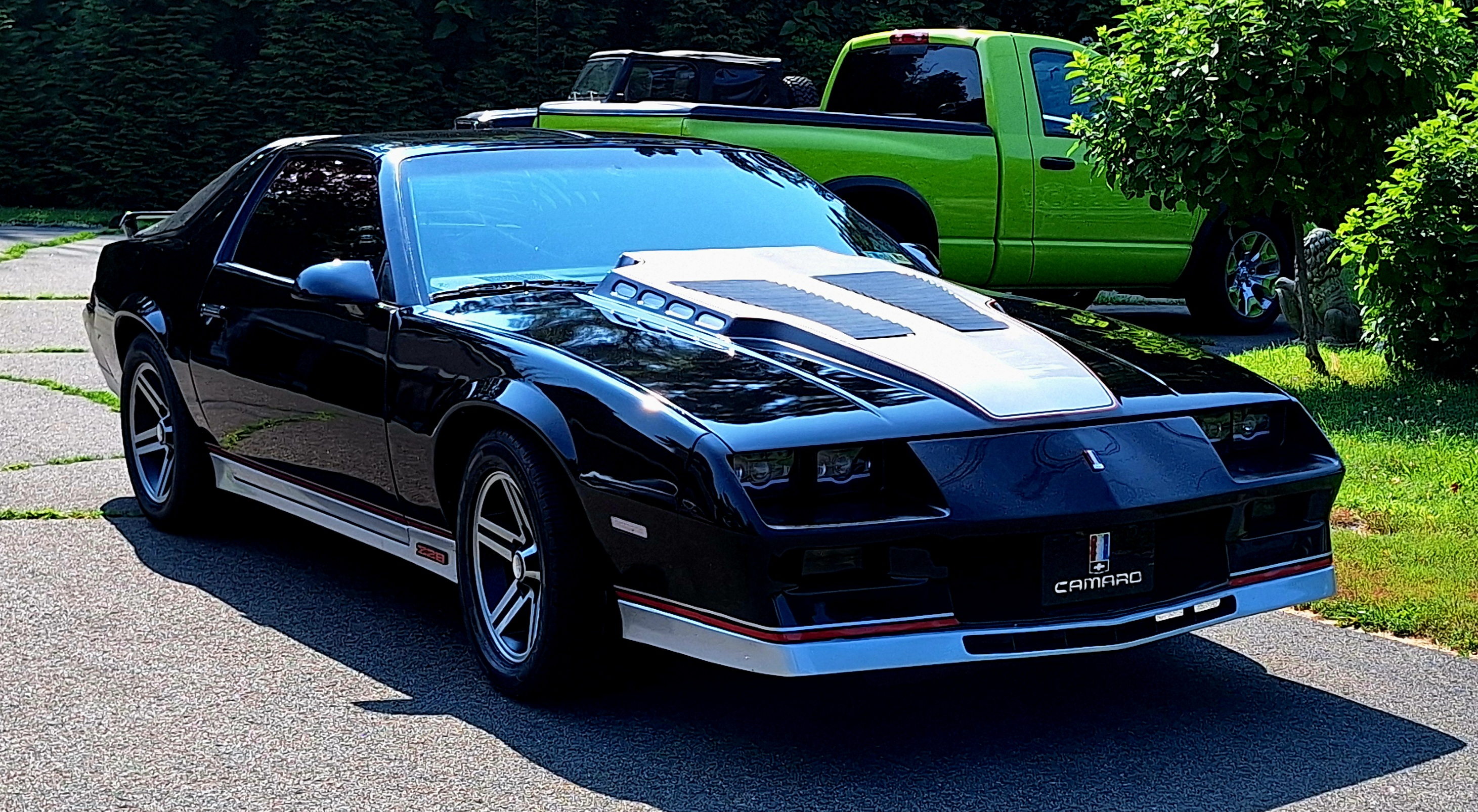 Gloss black Camaro Z28, front three-quarter view after a GTCustomz respray